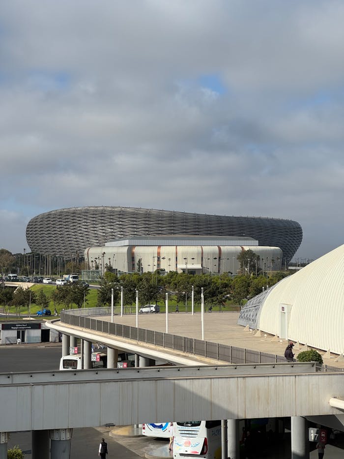 Exterior view of the modern Cape Town Stadium with overcast sky.